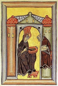 Hildegard von Bingen empfängt eine göttliche Inspiration und gibt sie an ihren Schreiber weiter. Miniatur aus dem Rupertsberger Codex des Liber Scivias.
Quelle: wikipedia